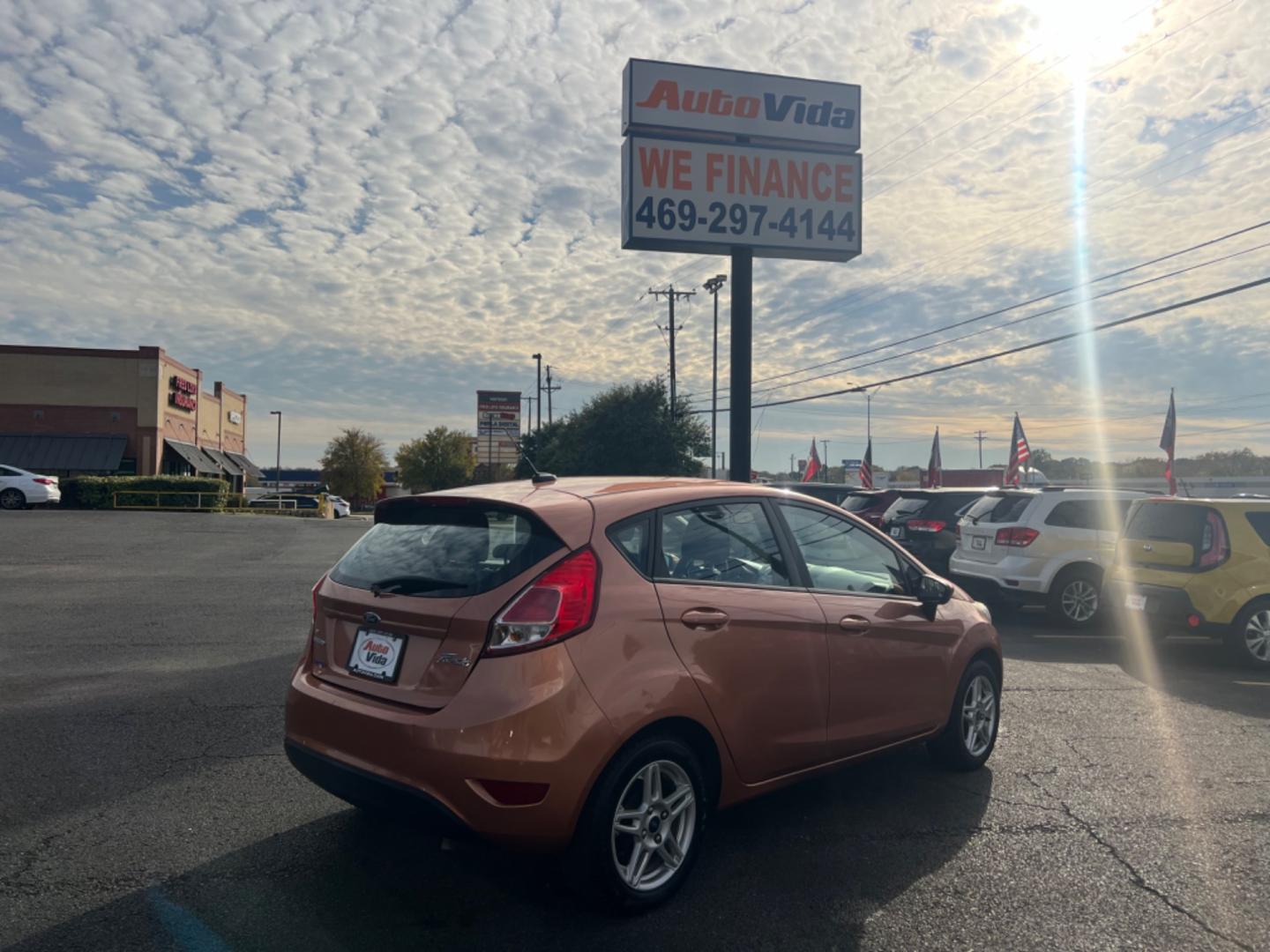 2017 ORANGE Ford Fiesta SE Hatchback (3FADP4EJ0HM) with an 1.6L L4 DOHC 16V engine, located at 420 I-35E, Lancaster, TX, 75146, (469) 297-4144, 32.593929, -96.823685 - Photo#5